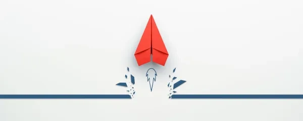 Paper aeroplane being used as a rocket