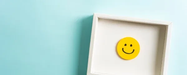 smiley face emoji in a frame