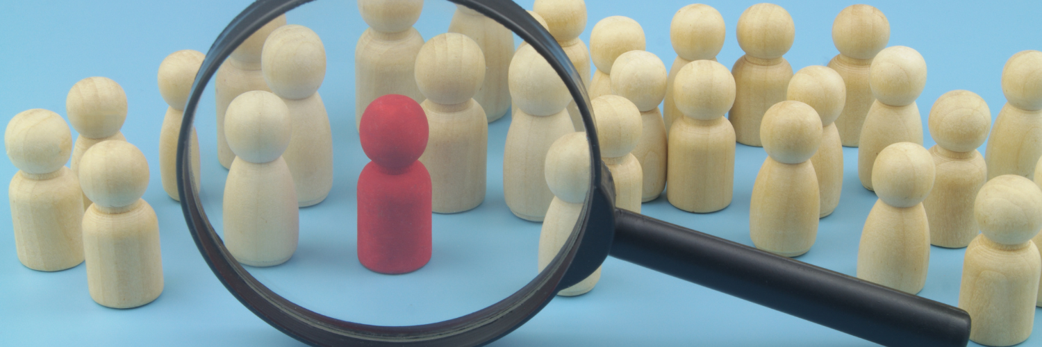 Magnifying Glass Wooden People One Red Web Banner (1)