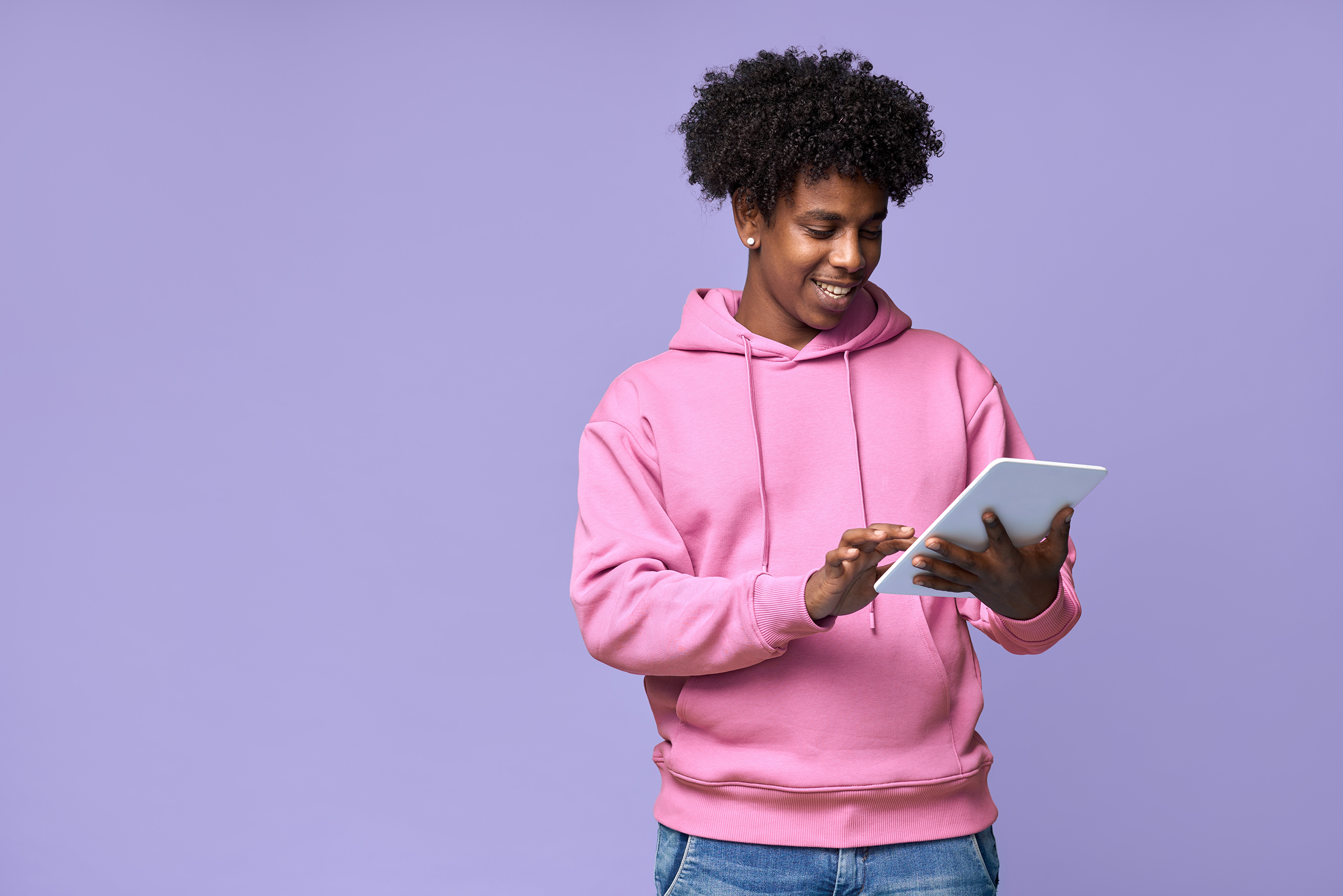 Man In Pink Hoodie On Tablet Web