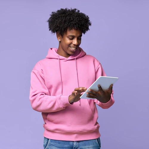 Man In Pink Hoodie On Tablet Web