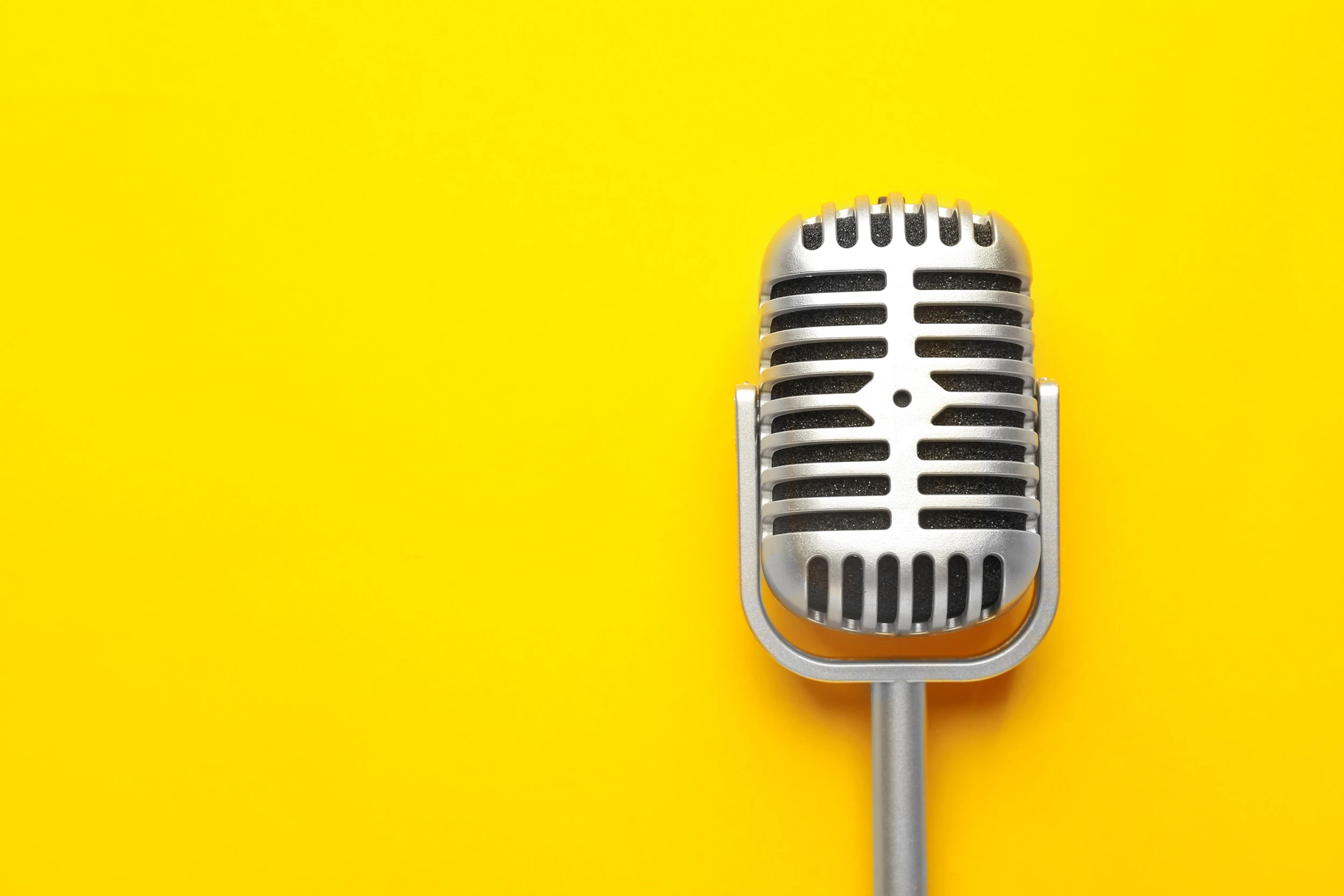Retro microphone yellow background