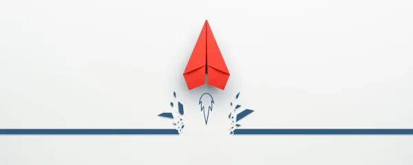 Paper aeroplane being used as a rocket
