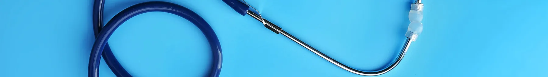 Blue stethoscope attached to computer mouse blue background resized