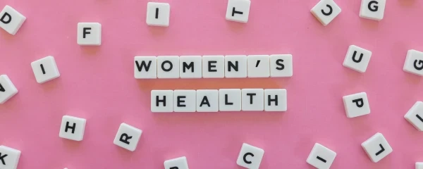 letters scattered with women's health spelled out