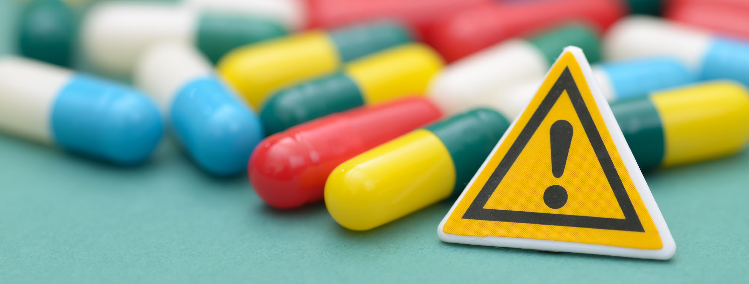 Tablets With Warning Sign Banner