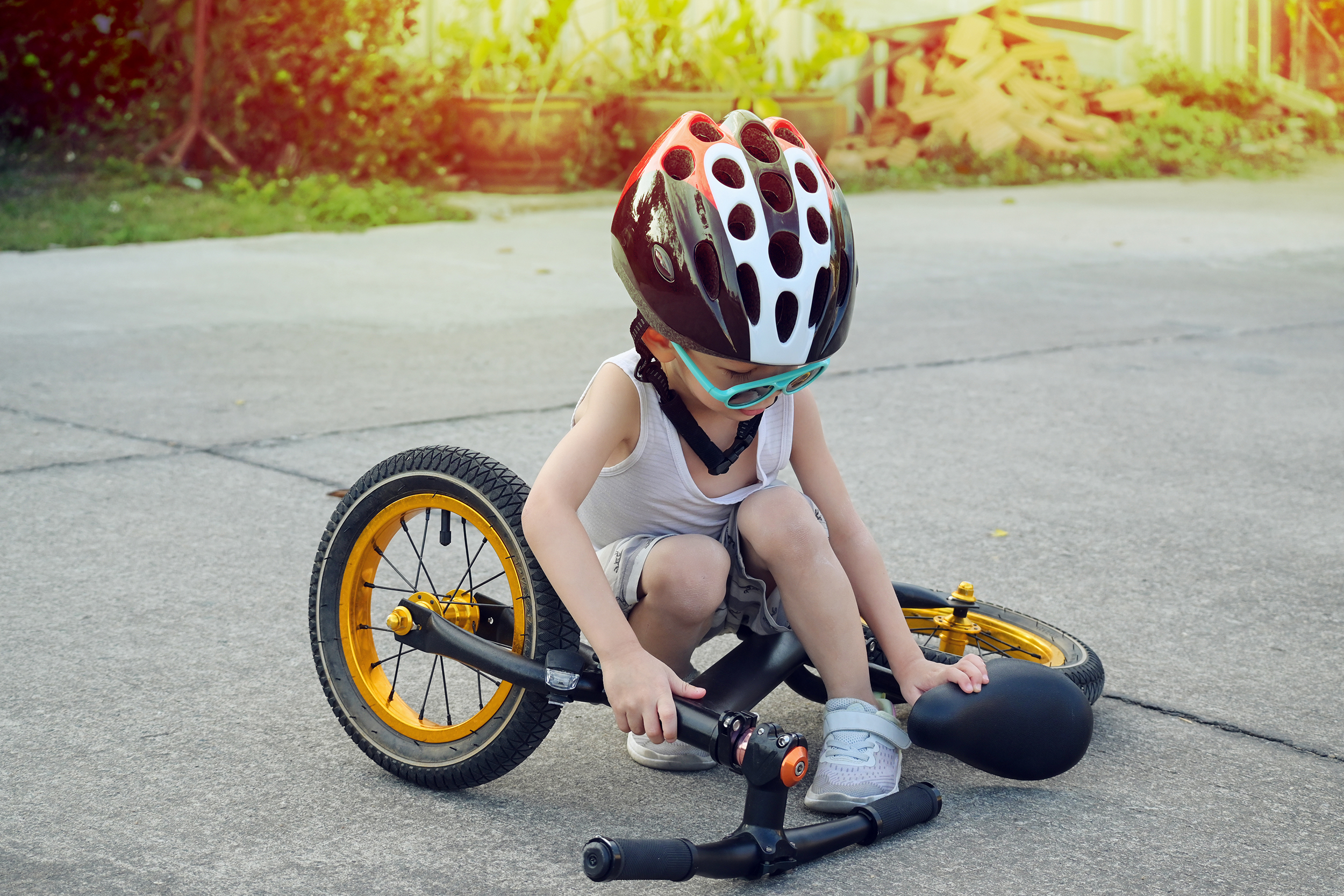 Boy Checking Bike With Helmet On Website