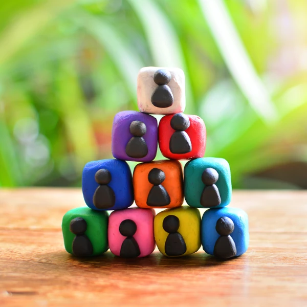 Thumbnail Pyramid Of Plasticine Blocks With People On