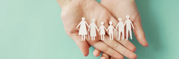 Hands Holding Chain Of Paper People Banner Web