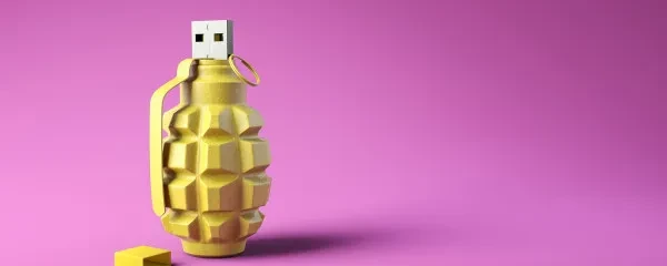 Grenade USB stick on purple background
